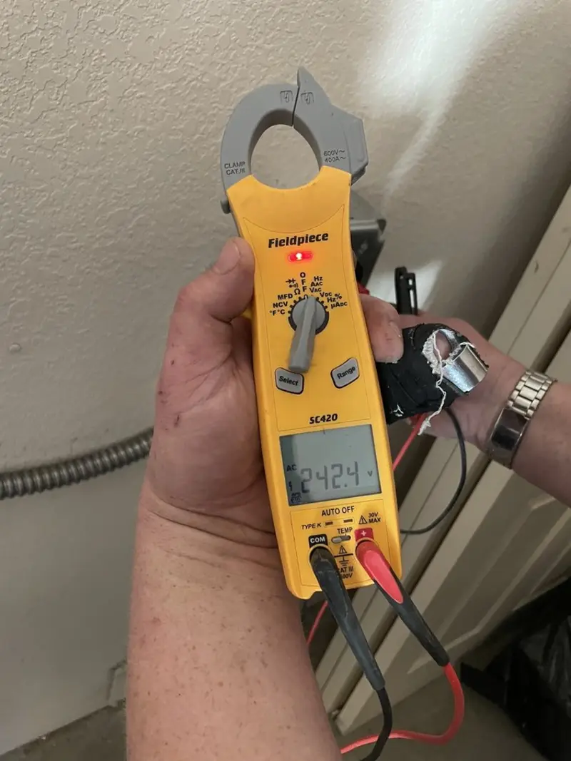 Voltage testing with clamp meter during Whole House Surge Protector in Aberdeen